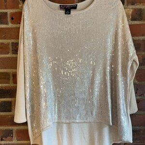 light tan sweater with clear sequins and silver snake print